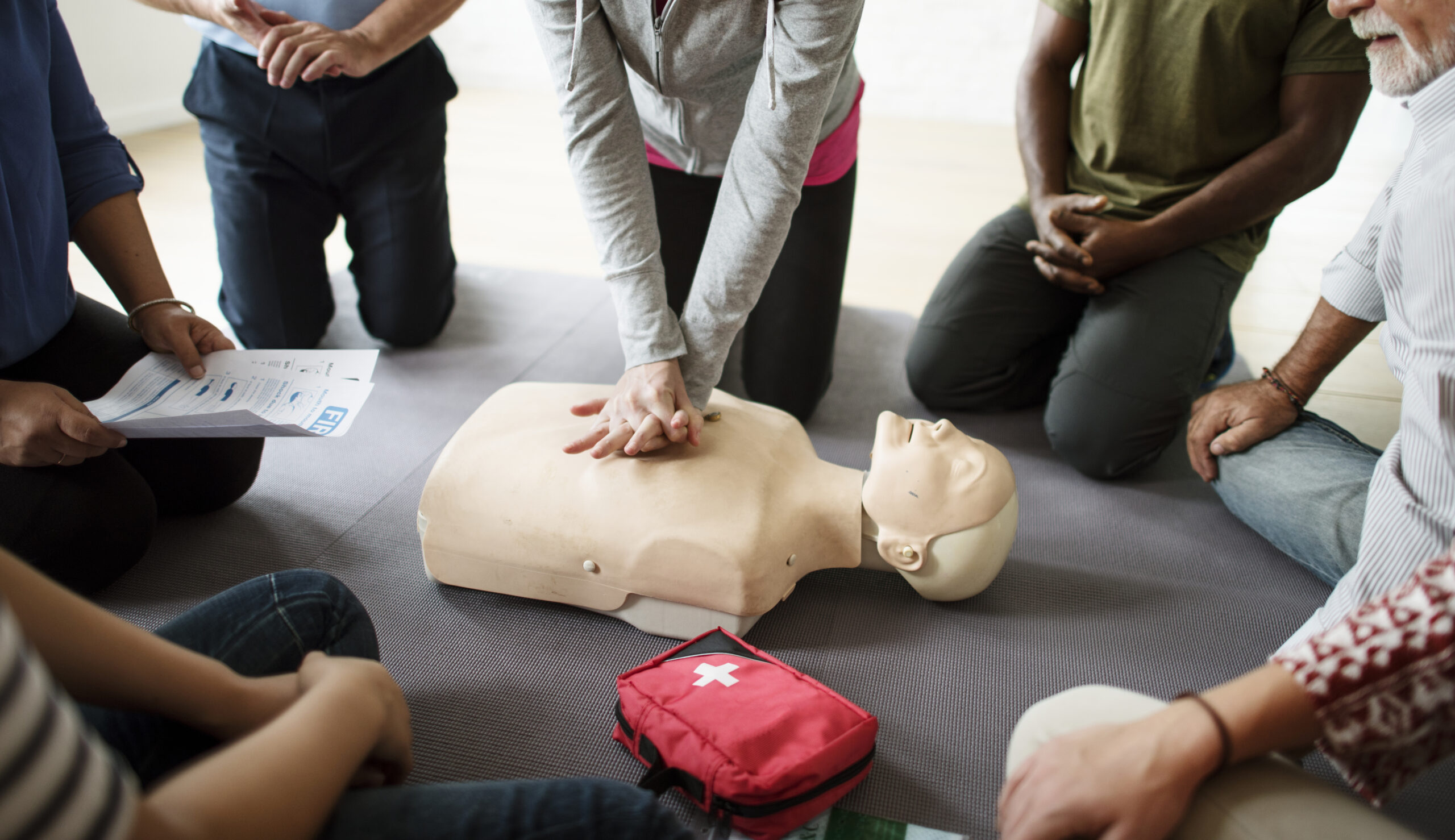Group of diverse people in cpr training class